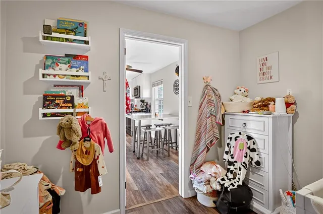 a view of a livingroom with furniture and toys