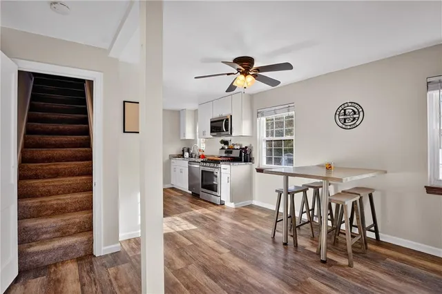 a view of a dining room with furniture window and wooden floor