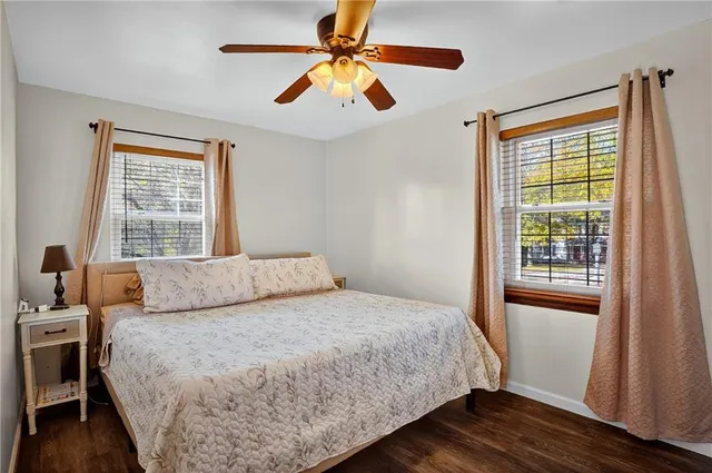 a bedroom with a large bed and a window