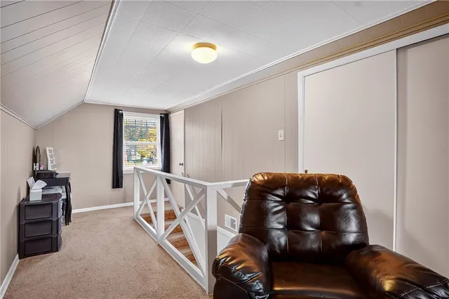a view of a livingroom with furniture and windows