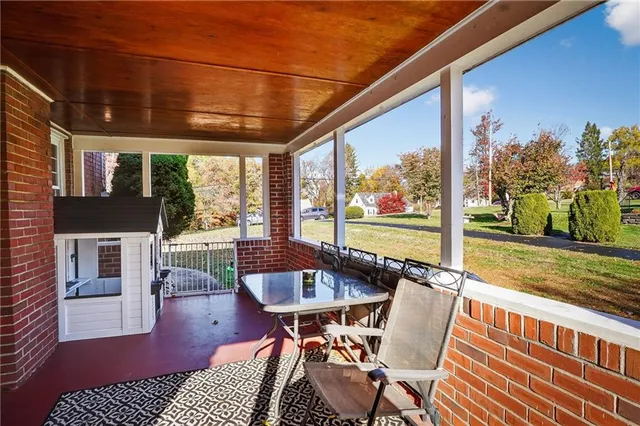 a view of a patio with a table chairs and a table