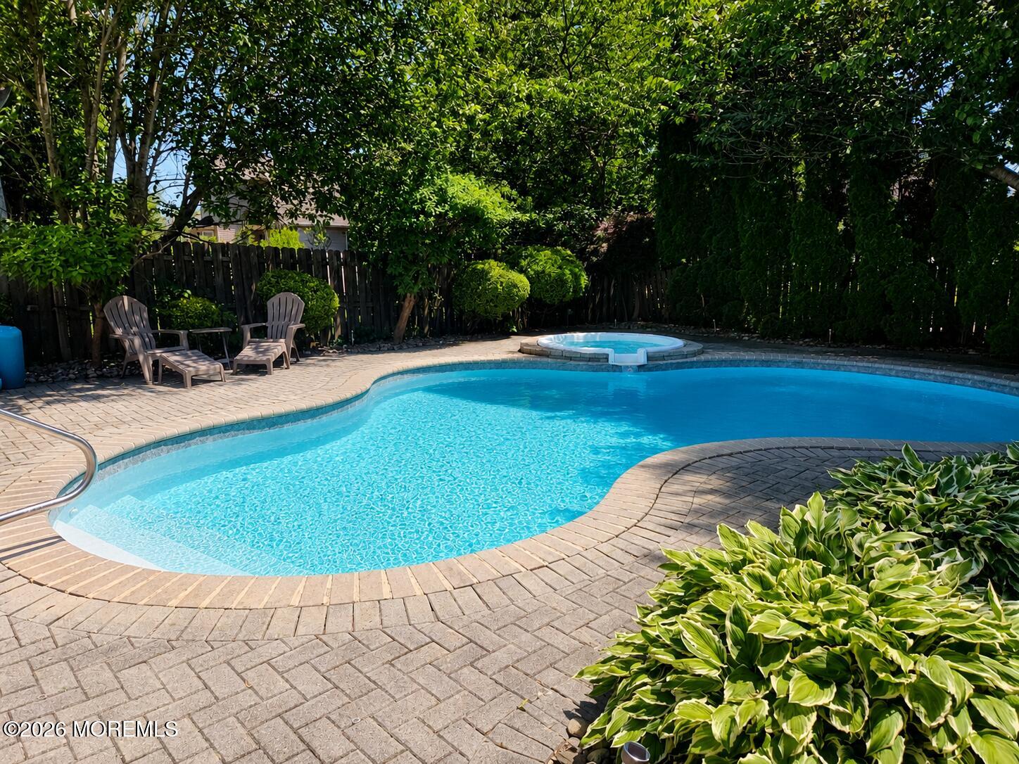 924 Ocean Road Point Pleasant, NJ 08742 - Photo 36 of 56 a view of a swimming pool with a patio