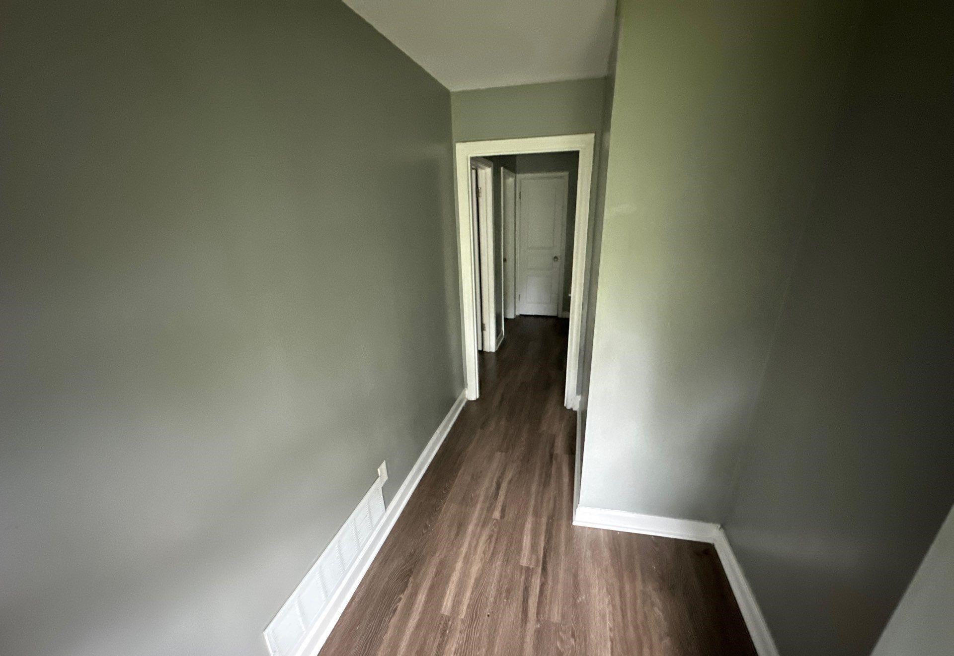 Corridor with dark wood-type flooring