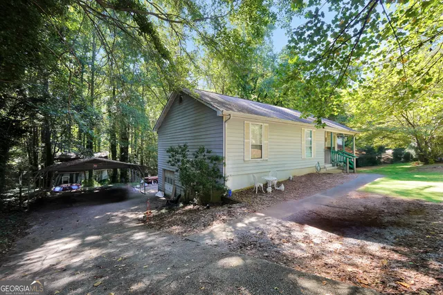 a view of a house with a yard and garage