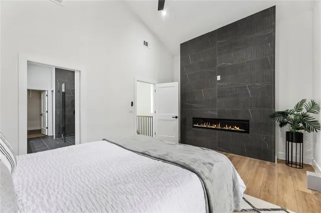 a view of a balcony with wooden floor and fence