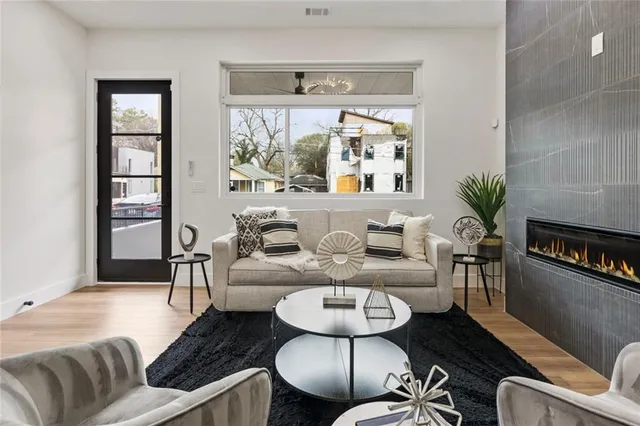 a living room with furniture and a table