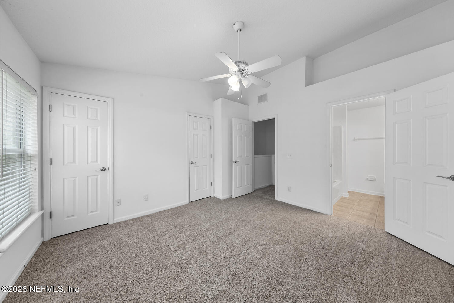 3532 Twisted Tree Lane Jacksonville, FL 32216 - Photo 13 of 23 an empty room with a ceiling fan and a window