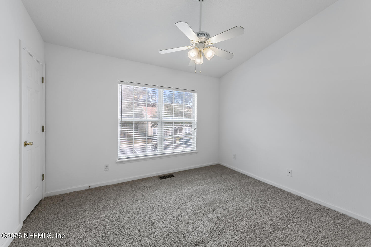 3532 Twisted Tree Lane Jacksonville, FL 32216 - Photo 16 of 23 an empty room with a window