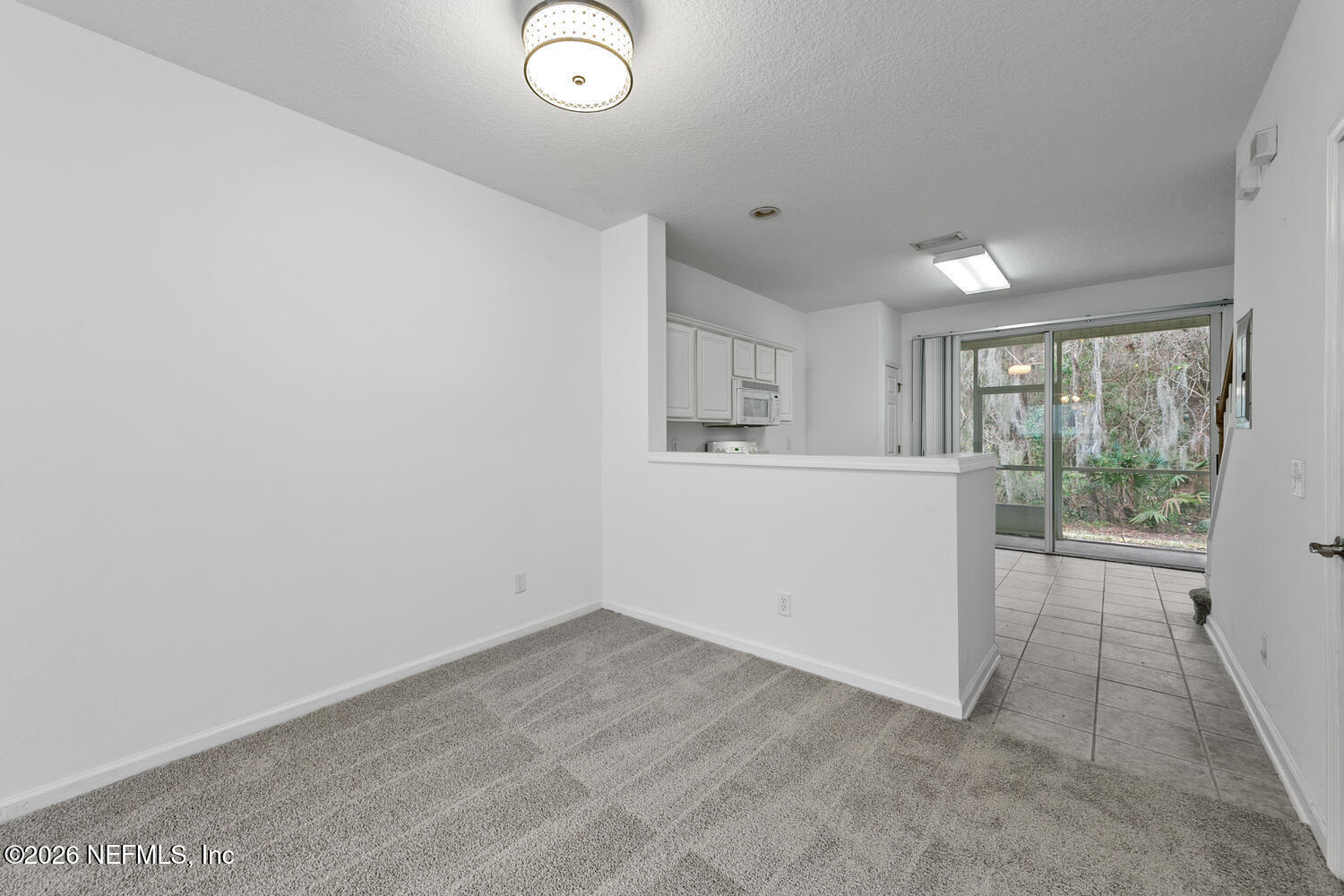 3532 Twisted Tree Lane Jacksonville, FL 32216 - Photo 3 of 23 an empty room with a window