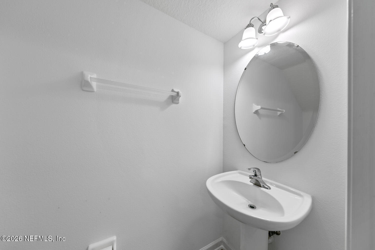 3532 Twisted Tree Lane Jacksonville, FL 32216 - Photo 10 of 23 a bathroom with a sink a mirror and vanity