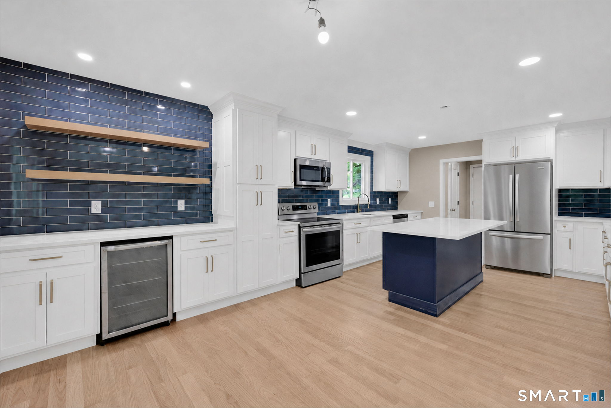 49 Millstone Road Glastonbury, CT 06033 - Photo 2 of 39 a large kitchen with a stove top oven and sink