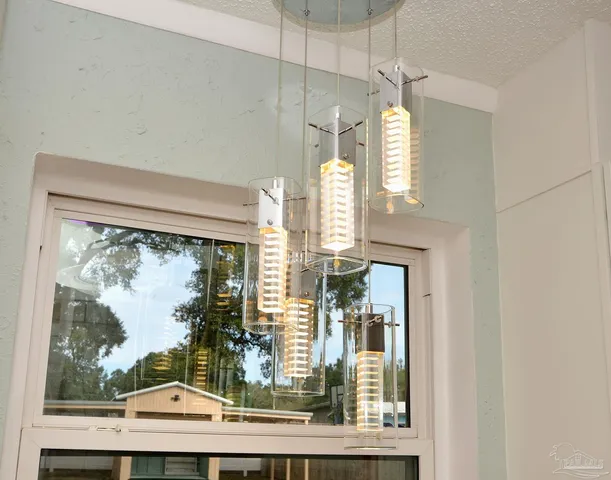a view of a living room with furniture and a window