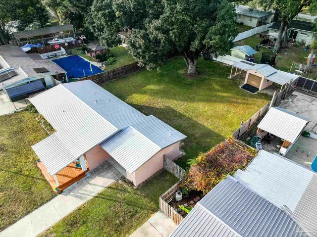 aerial view of a house with a garden and plants