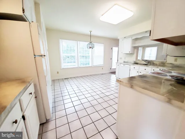 a view of a room with a ceiling fan