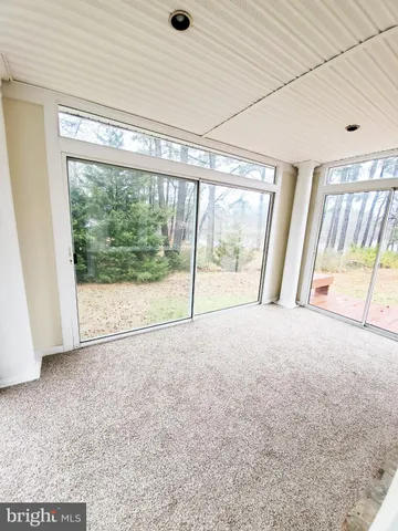 a view of a room with an empty space