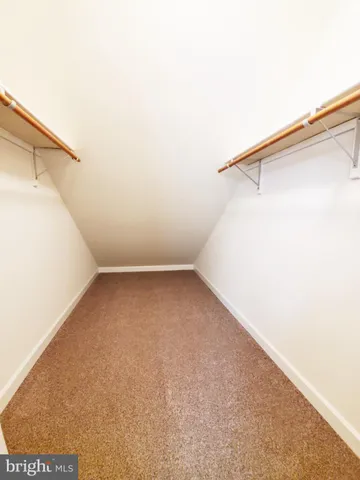 a view of a room with racks on the wall