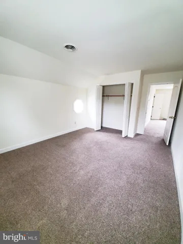 a kitchen with cabinets and window