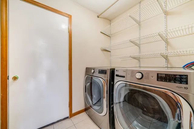 an empty room with a ceiling fan and window