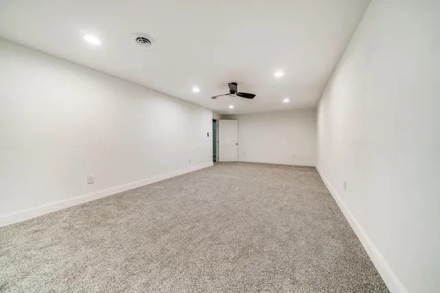 a view of a balcony with wooden floor
