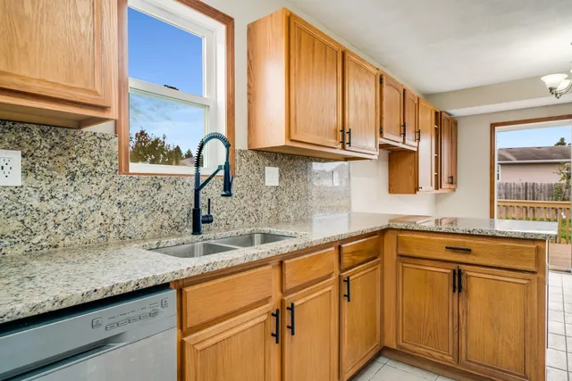 a kitchen with stainless steel appliances a stove a microwave and cabinets