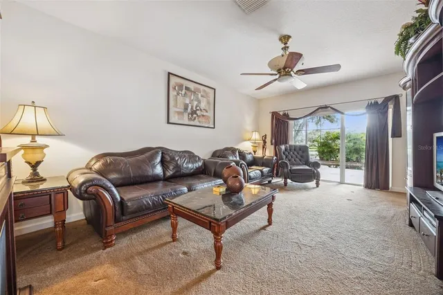 a kitchen with granite countertop a sink stove and refrigerator