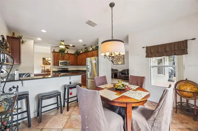 a bedroom with a bed dresser and a flat tv screen