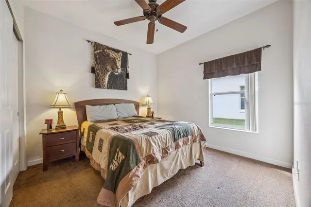 a view of a house with backyard porch and sitting area