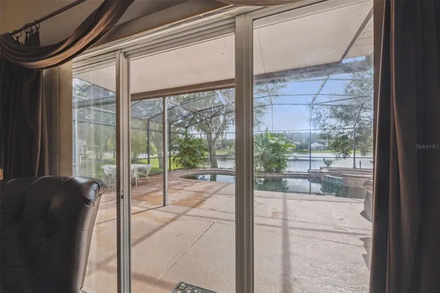 a view of a swimming pool with a patio