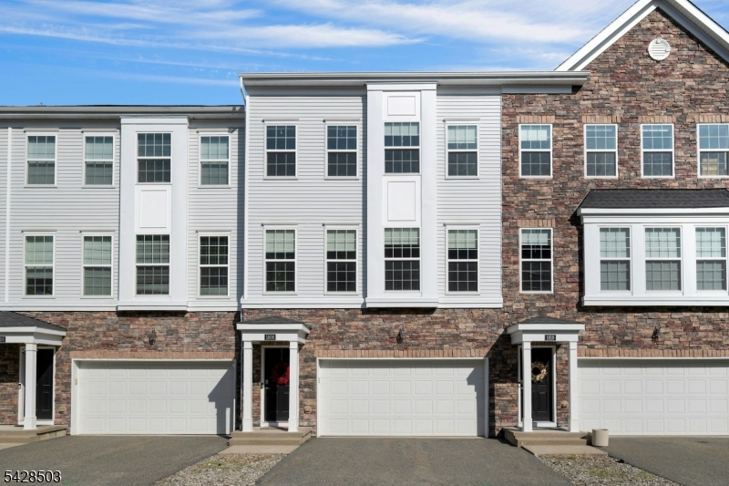1808 Devon Lane Rockaway, NJ 07866 - Photo 1 of 35 a front view of a building with a lot of windows