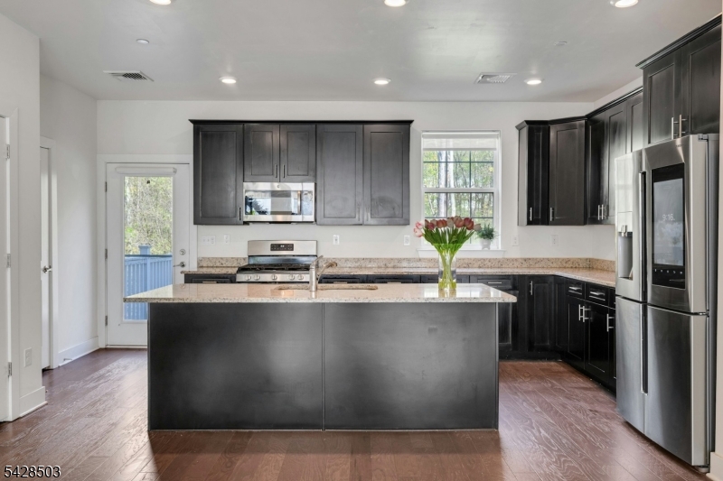 1808 Devon Lane Rockaway, NJ 07866 - Photo 14 of 35 a kitchen with stainless steel appliances granite countertop a sink a stove and refrigerator