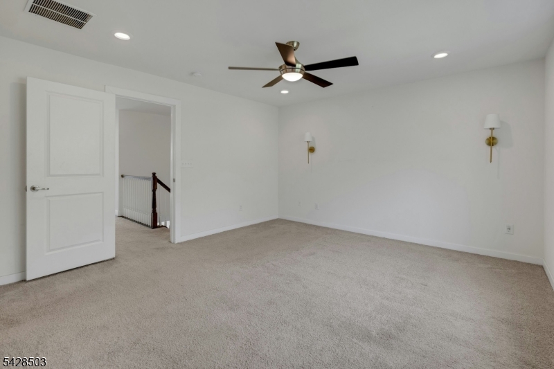 1808 Devon Lane Rockaway, NJ 07866 - Photo 17 of 35 an empty room with a ceiling fan and window
