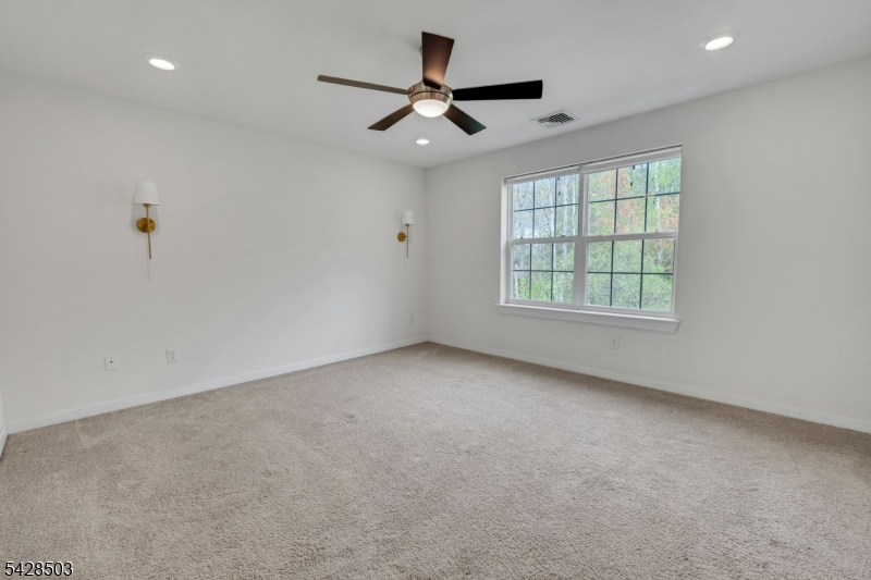 1808 Devon Lane Rockaway, NJ 07866 - Photo 18 of 35 an empty room with windows and ceiling fan