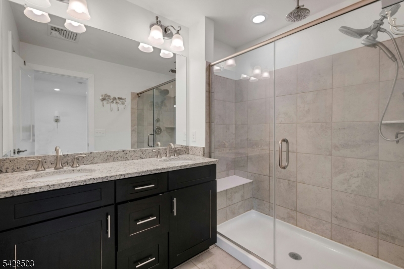 1808 Devon Lane Rockaway, NJ 07866 - Photo 20 of 35 a bathroom with a granite countertop sink a toilet a mirror and shower