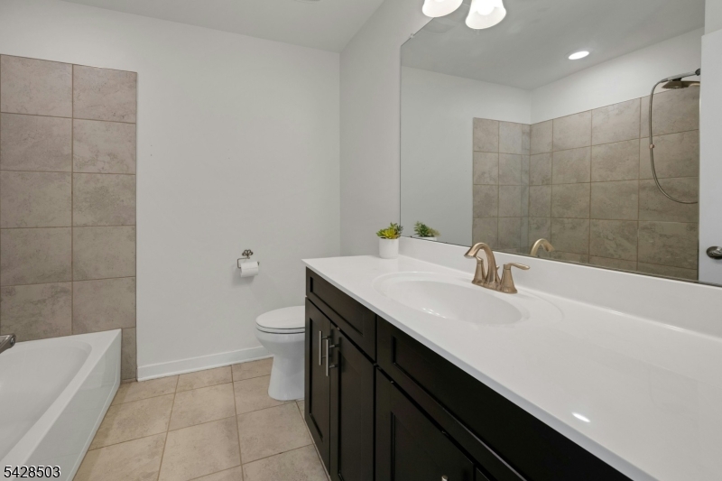 1808 Devon Lane Rockaway, NJ 07866 - Photo 26 of 35 a bathroom with a sink a toilet and shower