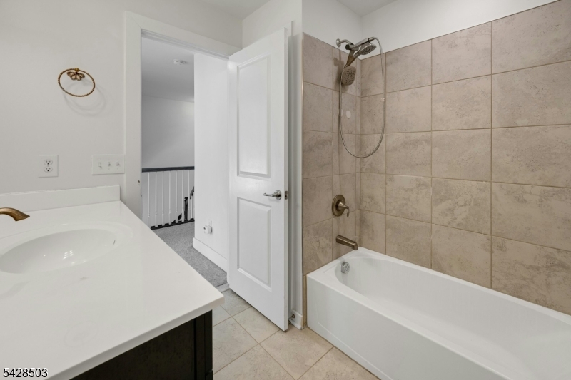 1808 Devon Lane Rockaway, NJ 07866 - Photo 27 of 35 a bathroom with a tub a sink and a shower