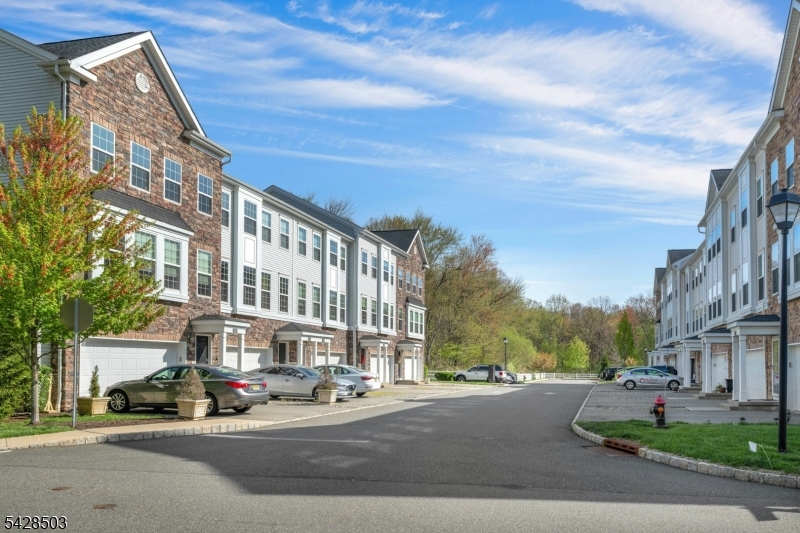 1808 Devon Lane Rockaway, NJ 07866 - Photo 3 of 35 a city street lined with buildings and cars