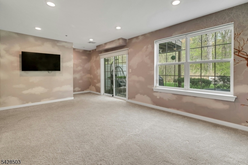 1808 Devon Lane Rockaway, NJ 07866 - Photo 31 of 35 a view of a livingroom with a flat screen tv and windows