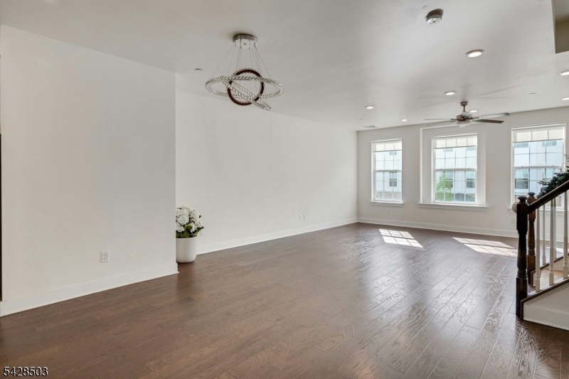 1808 Devon Lane Rockaway, NJ 07866 - Photo 5 of 35 an empty room with wooden floor and windows