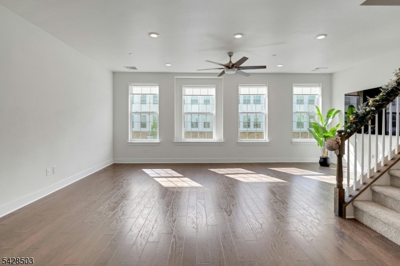 1808 Devon Lane Rockaway, NJ 07866 - Photo 6 of 35 a view of an empty room with a window and wooden floor