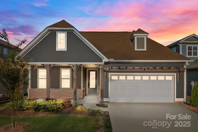 a front view of a house with yard