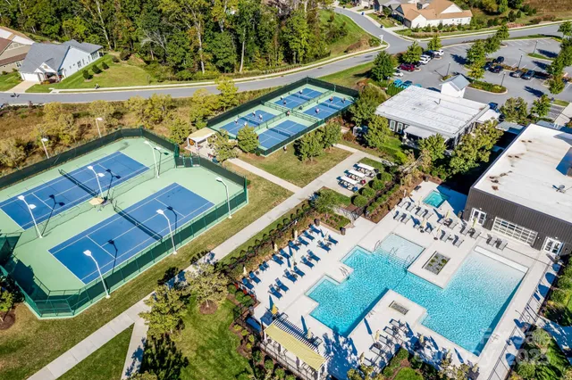 a living room with furniture ceiling fan and a rug
