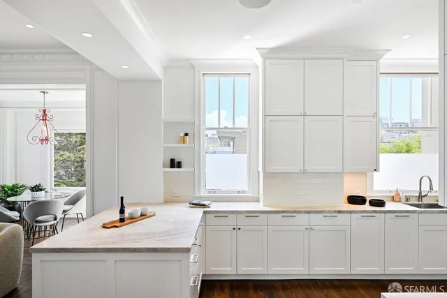 a living room with furniture rug and window