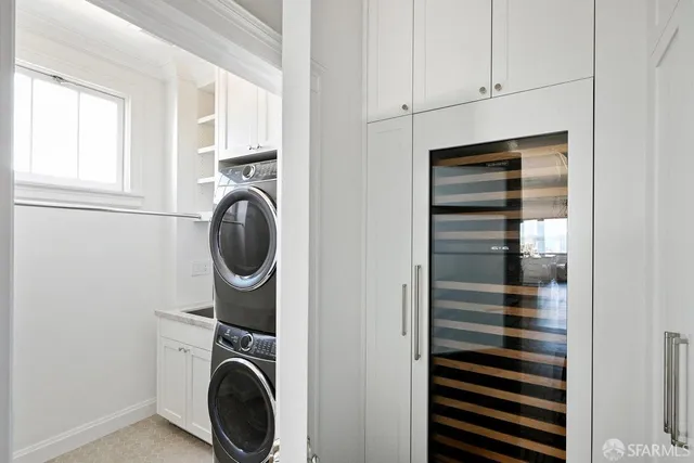 a view of a window and a kitchen area with wooden floor