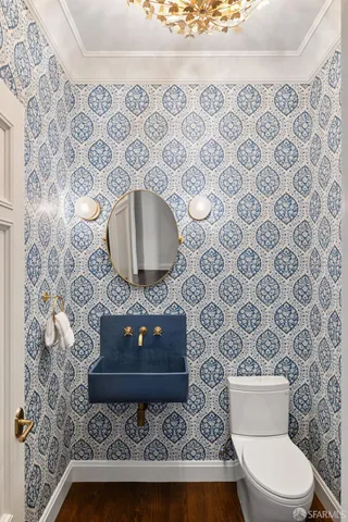 a view of a livingroom with wooden floor and a window
