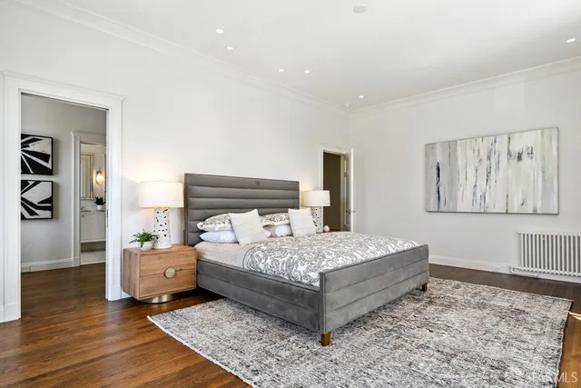 a bathroom with a sink vanity mirror and toilet