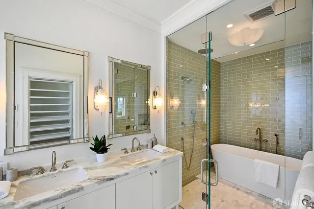 a bathroom with a granite countertop sink a mirror and shower
