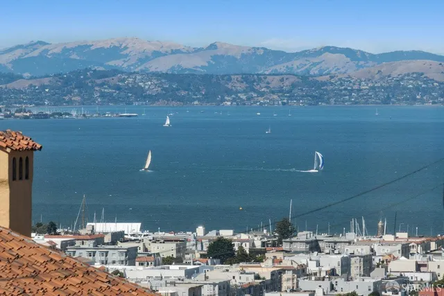 a living room with furniture or couch and a large window