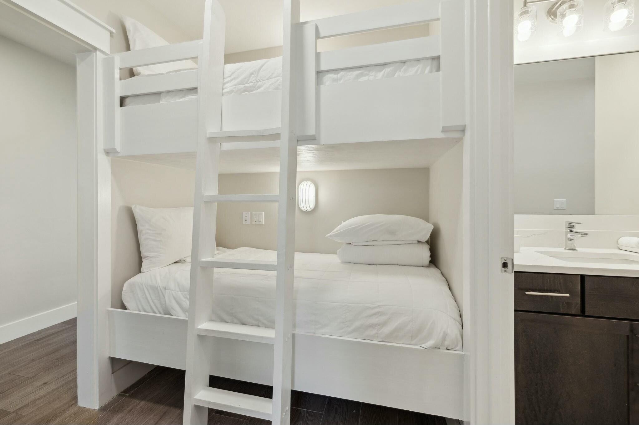 202 Henderson Resort Way, Unit 1204 Destin, FL 32541 - Photo 22 of 29 a bedroom with a bed and a cabinets