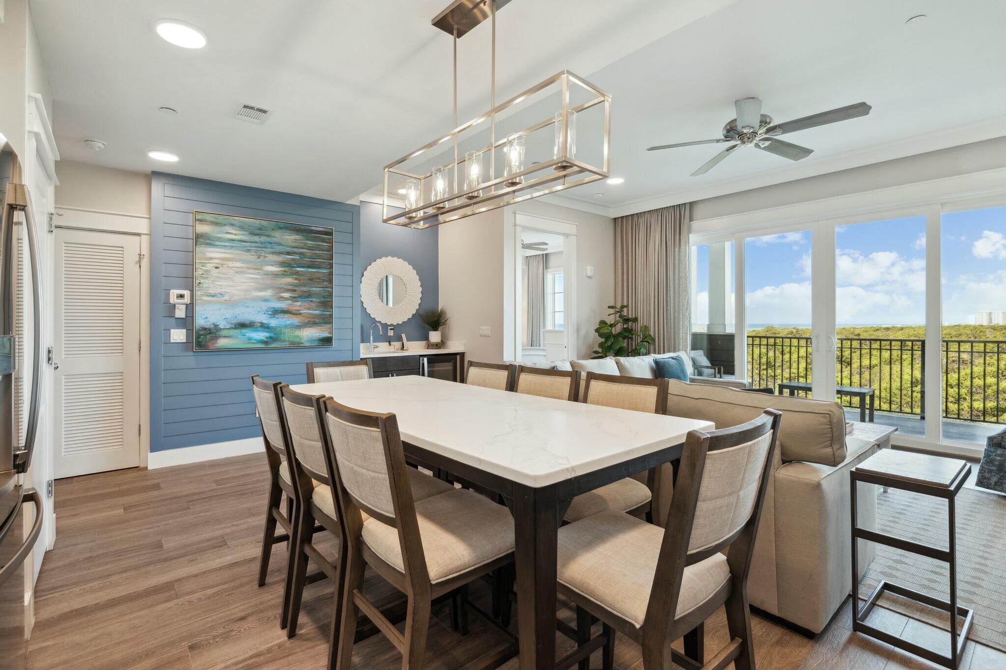 202 Henderson Resort Way, Unit 1204 Destin, FL 32541 - Photo 6 of 29 a view of a dining room with furniture window and wooden floor
