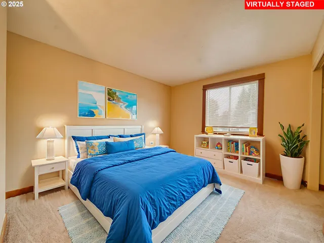 a bedroom with a large bed and a large window